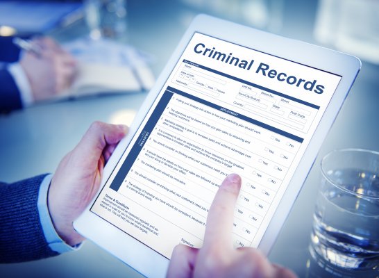 background check services truthfinder cost price how much man holding tablet checking criminal records